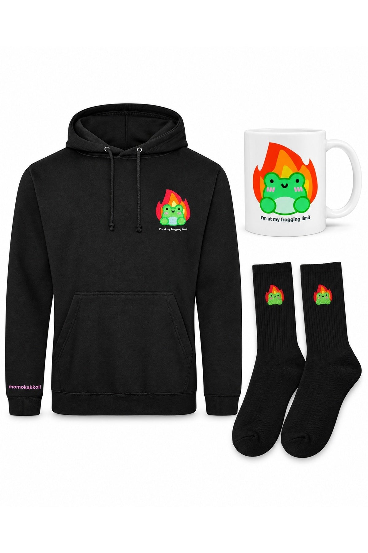 White-background product arrangement: one black I'm At My Frogging Limit embroidered hoodie, one matching white ceramic mug, one pair black Albert In Flames embroidered socks.