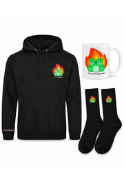 White-background product arrangement: one black I'm At My Frogging Limit embroidered hoodie, one matching white ceramic mug, one pair black Albert In Flames embroidered socks.