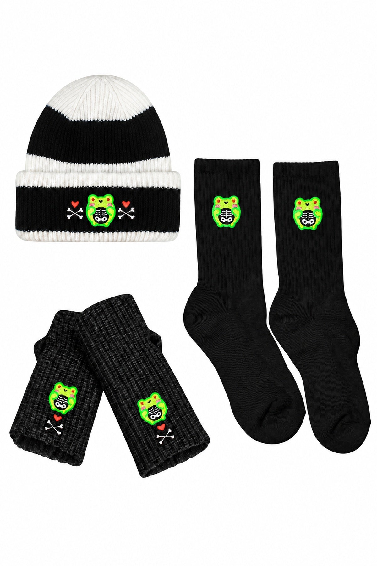 White-background product arrangement: one black-and-white striped Skelly Albert beanie, one pair black Skelly handwarmers, one pair black Skelly socks.